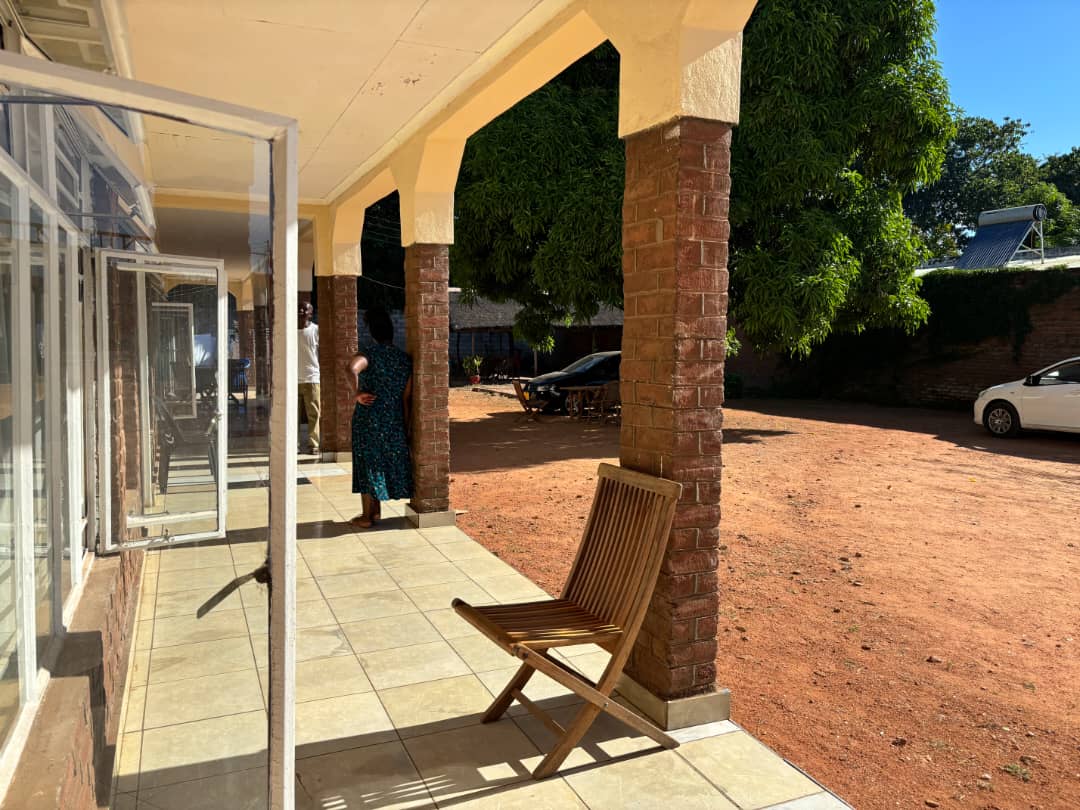 Covered patio and courtyard entrance at Mama's B&B, a bed and breakfast in Salima, Malawi